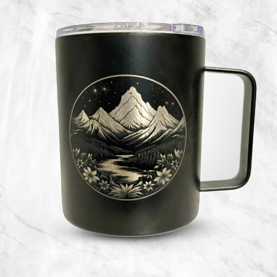 A coffee mug featuring a mountain seen laser engraved onto it